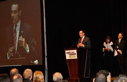 Mayor Gray speaking at the podium of the Realscreen Summit in Washington, DC